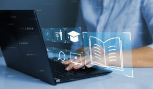 A photo illustration of a man typing on a laptop with various graphic icons superimposed over top.